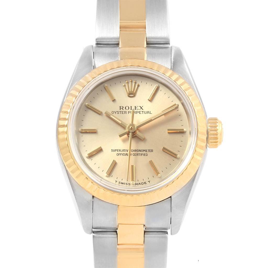 This image shows a frontal view of a Rolex Oyster Perpetual 67193 Women's Steel and Gold (two tone) Silver Dial 67193 Women's Steel and Gold (two tone) Silver Dial watch, highlighting its dial, bezel, bracelet, and crown.