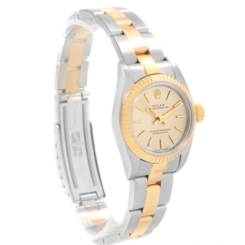 This image shows a side-front angle of the Rolex Oyster Perpetual 67193 Women's Steel and Gold (two tone) Silver Dial 67193 Women's Steel and Gold (two tone) Silver Dial watch, highlighting its two-tone bracelet and dial.
