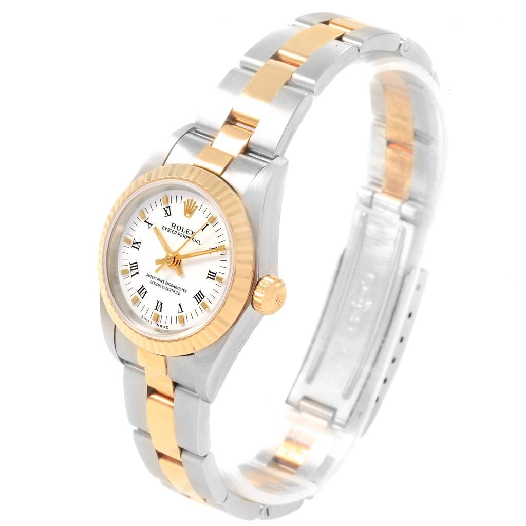 The Rolex Oyster Perpetual 76193 Women's Steel and Gold (two tone) White Dial 76193 Women's Steel and Gold (two tone) White Dial watch is shown from an angled top view, highlighting its bezel, dial, and two-tone bracelet.
