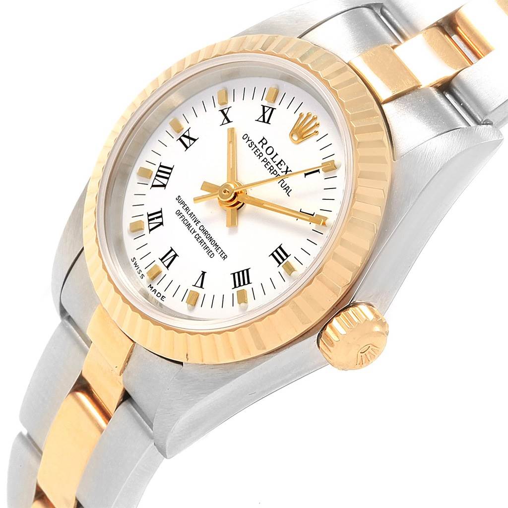 The image shows a close-up of a Rolex Oyster Perpetual 76193 Women's Steel and Gold (two tone) White Dial 76193 Women's Steel and Gold (two tone) White Dial watch at an angled view, highlighting the dial, bezel, crown, and bracelet.
