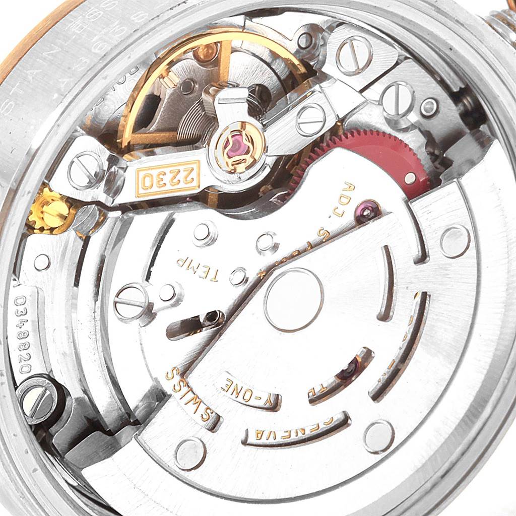 This image shows a close-up view of the internal movement mechanism of a Rolex Oyster Perpetual 76193 Women's Steel and Gold (two tone) White Dial 76193 Women's Steel and Gold (two tone) White Dial watch.