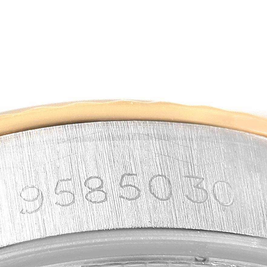 This image shows a close-up of the serial number engraving on the side of a Rolex Oyster Perpetual 67193 Women
s Steel and Gold (two tone) Champagne Dial 67193 Women
s Steel and Gold (two tone) Champagne Dial watch case.