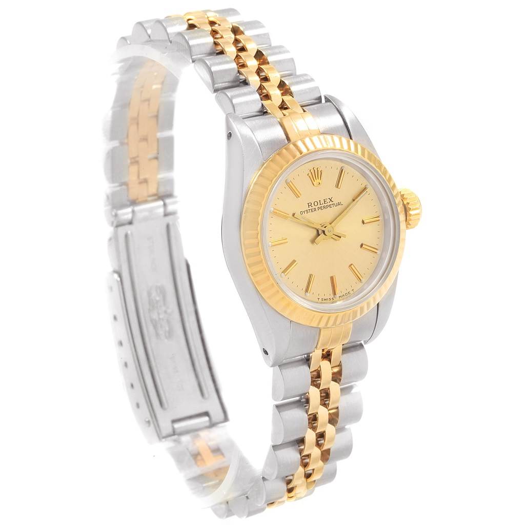 The image shows a Rolex Oyster Perpetual 67193 Women's Steel and Gold (two tone) Champagne Dial 67193 Women's Steel and Gold (two tone) Champagne Dial watch at an angled side view, highlighting its gold and silver bracelet and gold bezel.