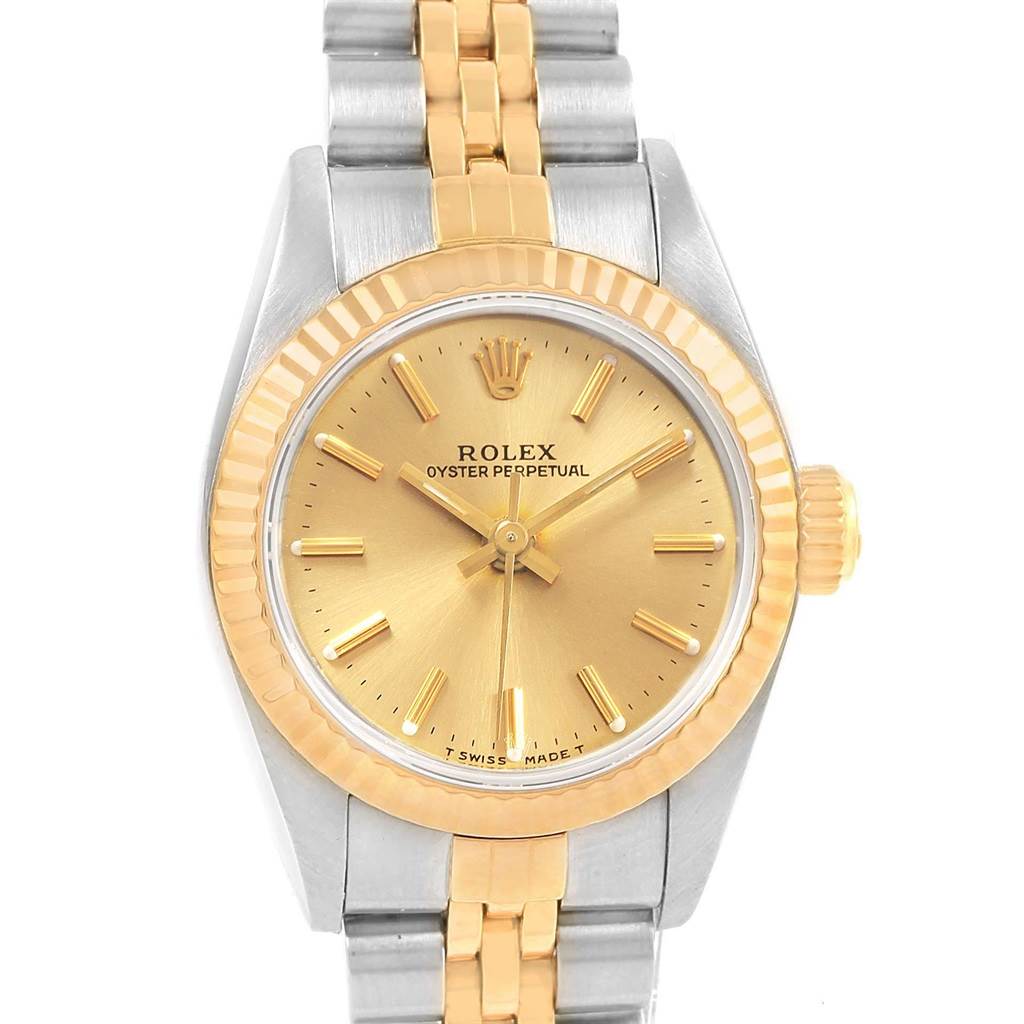The image shows the front view of the Rolex Oyster Perpetual 67193 Women's Steel and Gold (two tone) Champagne Dial 67193 Women's Steel and Gold (two tone) Champagne Dial watch with a gold-colored dial and two-tone bracelet.