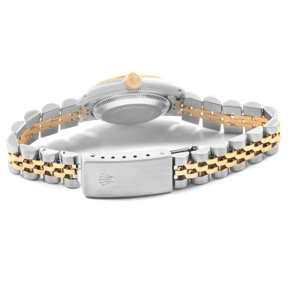 The image shows the back view of a Rolex Oyster Perpetual 67193 Women's Steel and Gold (two tone) Champagne Dial 67193 Women's Steel and Gold (two tone) Champagne Dial watch, highlighting the bracelet and clasp.