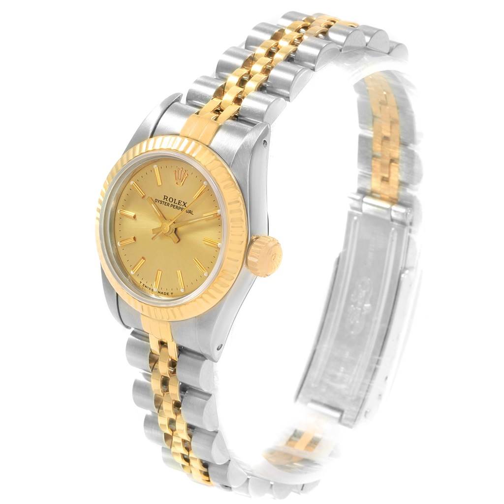 This image shows a side view of a Rolex Oyster Perpetual 67193 Women's Steel and Gold (two tone) Champagne Dial 67193 Women's Steel and Gold (two tone) Champagne Dial watch with a gold and silver bracelet and gold bezel.