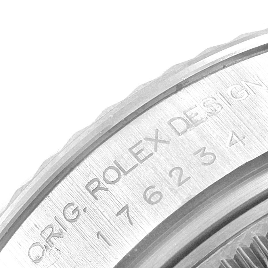 This image shows a close-up of the engraved side of the bezel of an Oyster Perpetual Rolex watch.