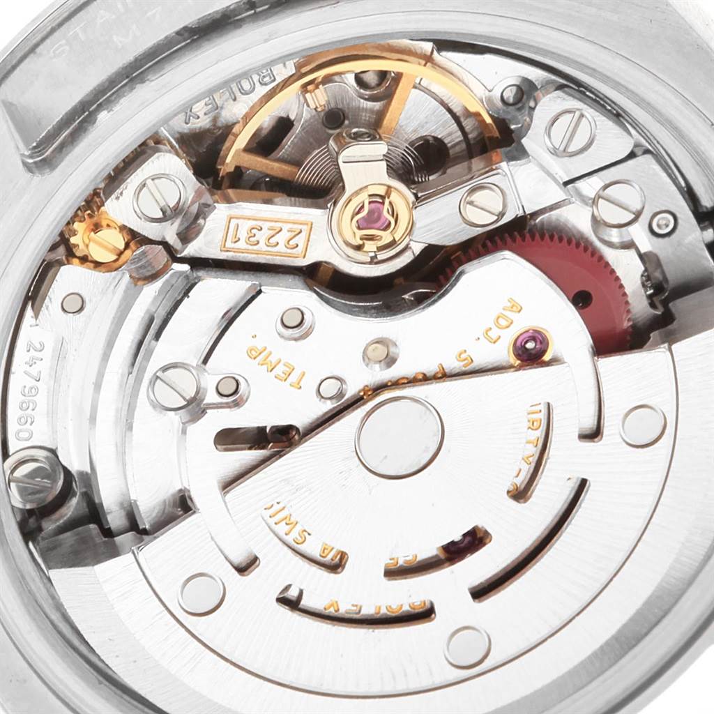 The image shows a close-up view of the movement and internal mechanism of a Rolex Oyster Perpetual 176200 Women's Stainless Steel Silver Dial 176200 Women's Stainless Steel Silver Dial watch.