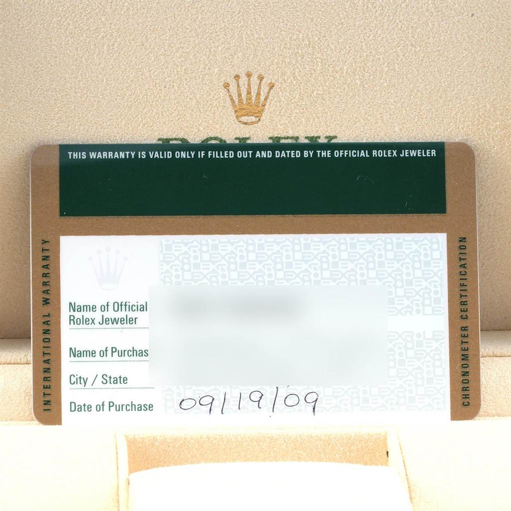 The image shows the warranty card for the Rolex Oyster Perpetual 176200 Women's Stainless Steel Silver Dial 176200 Women's Stainless Steel Silver Dial watch in a display case.