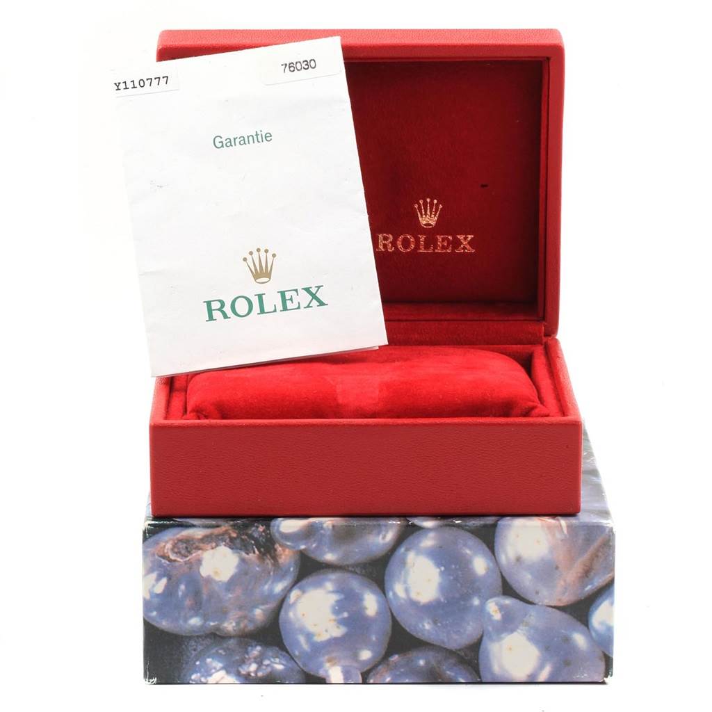 This image shows the open box and warranty booklet for the Rolex Oyster Perpetual 76030 Women
s Stainless Steel Silver Dial 76030 Women
s Stainless Steel Silver Dial model.