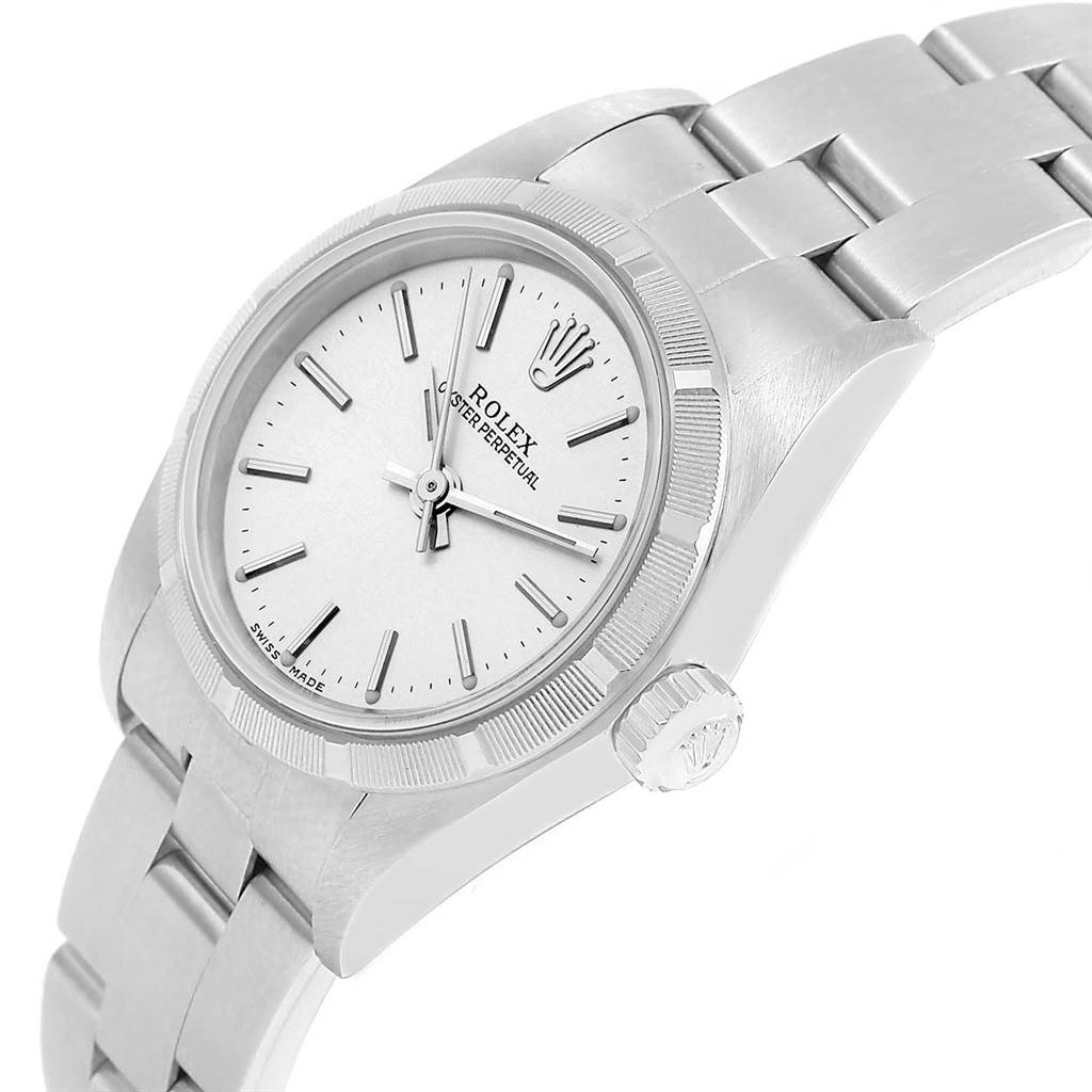 This image shows a Rolex Oyster Perpetual 76030 Women
s Stainless Steel Silver Dial 76030 Women
s Stainless Steel Silver Dial watch from a high angle, displaying the face, bracelet, and crown.