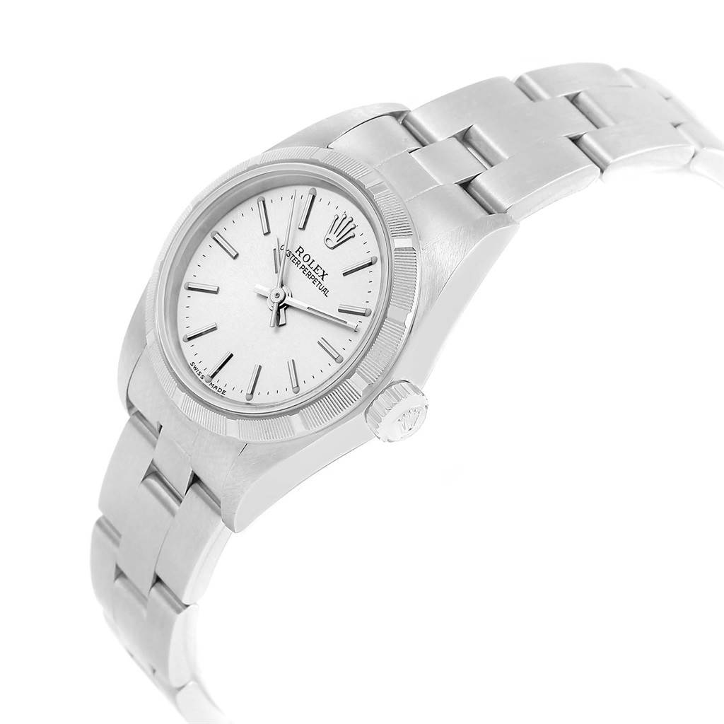 The image shows a side angle of a Rolex Oyster Perpetual 76030 Women
s Stainless Steel Silver Dial 76030 Women
s Stainless Steel Silver Dial watch, highlighting the dial, bezel, crown, and bracelet.