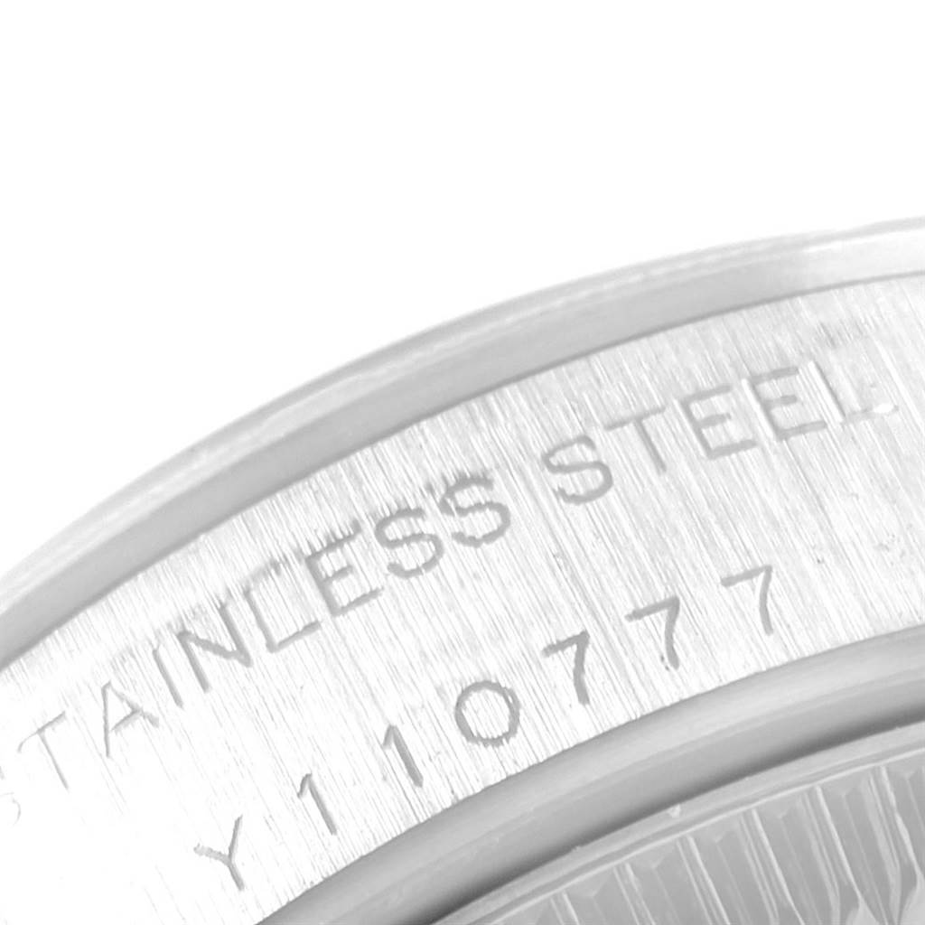This close-up image shows the stainless steel case back with engraved details of the Rolex Oyster Perpetual 76030 Women
s Stainless Steel Silver Dial 76030 Women
s Stainless Steel Silver Dial watch.
