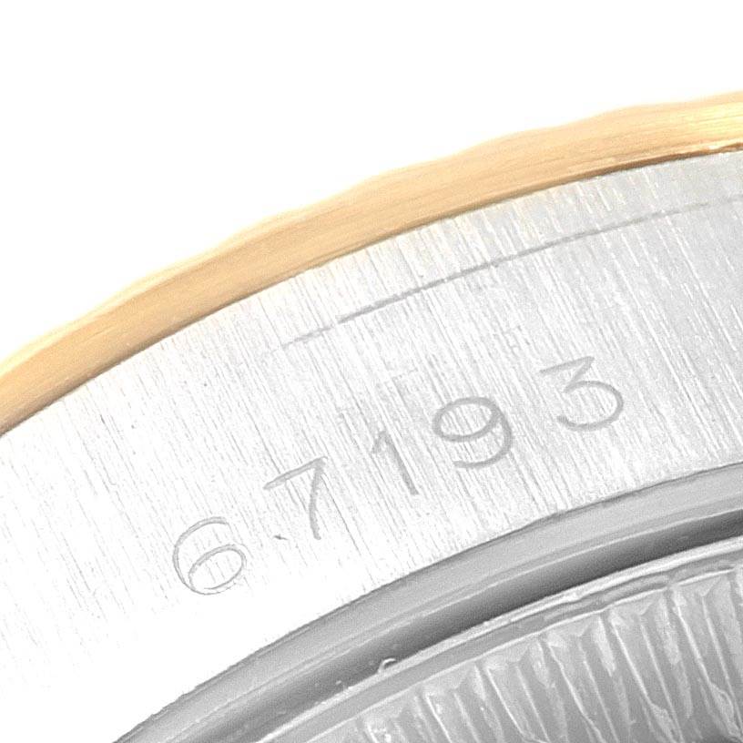 This close-up angle shows a partial view of the case and reference number on a Rolex Oyster Perpetual 67193 Women
s Steel and Gold (two tone) Silver Dial 67193 Women
s Steel and Gold (two tone) Silver Dial watch.