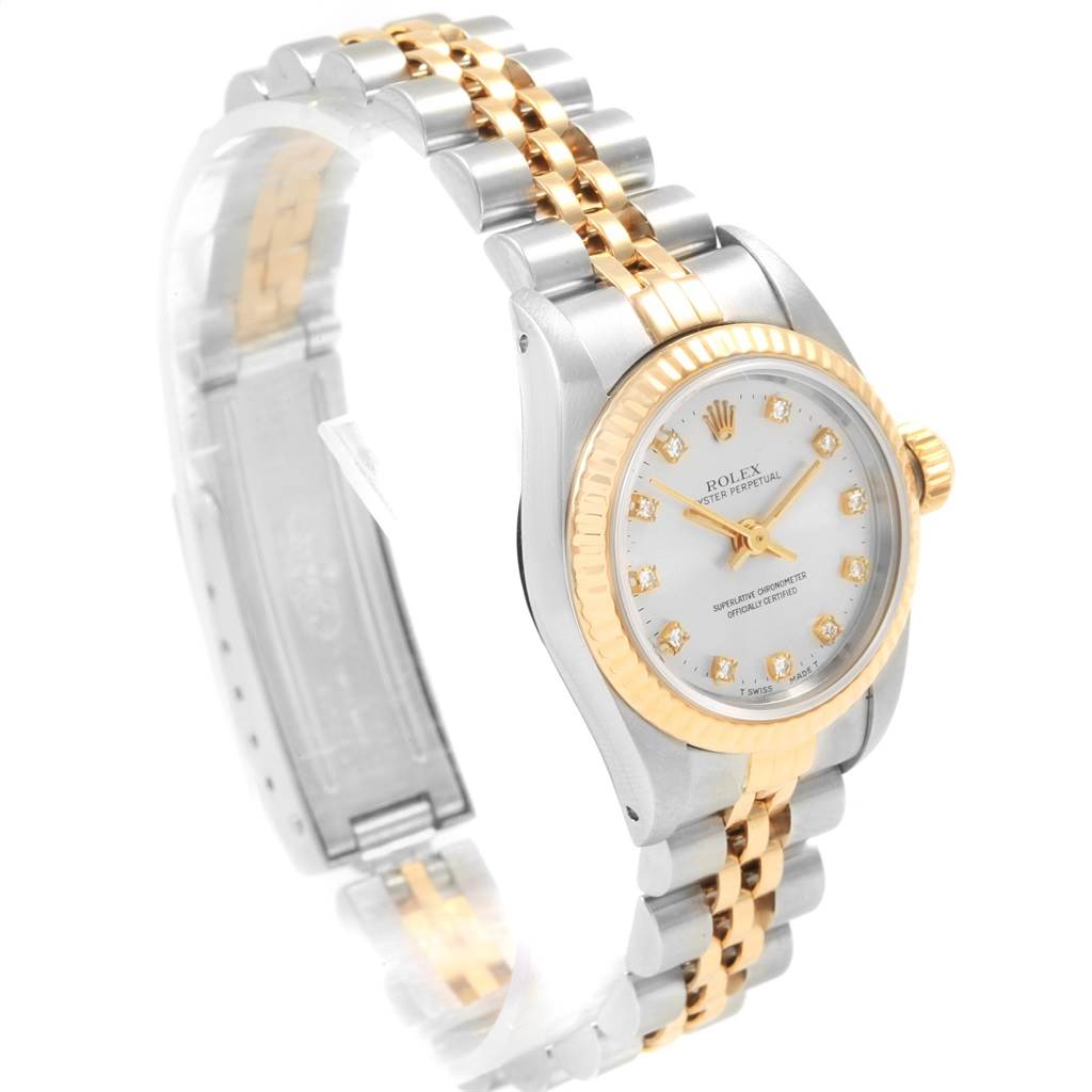 The image shows a Rolex Oyster Perpetual 67193 Women
s Steel and Gold (two tone) Silver Dial 67193 Women
s Steel and Gold (two tone) Silver Dial watch at a three-quarter angle, highlighting the dial and two-tone bracelet.