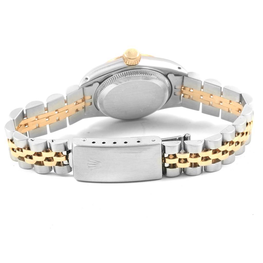 This image shows the back case and the two-tone metal bracelet of the Rolex Oyster Perpetual 67193 Women
s Steel and Gold (two tone) Silver Dial 67193 Women
s Steel and Gold (two tone) Silver Dial watch.