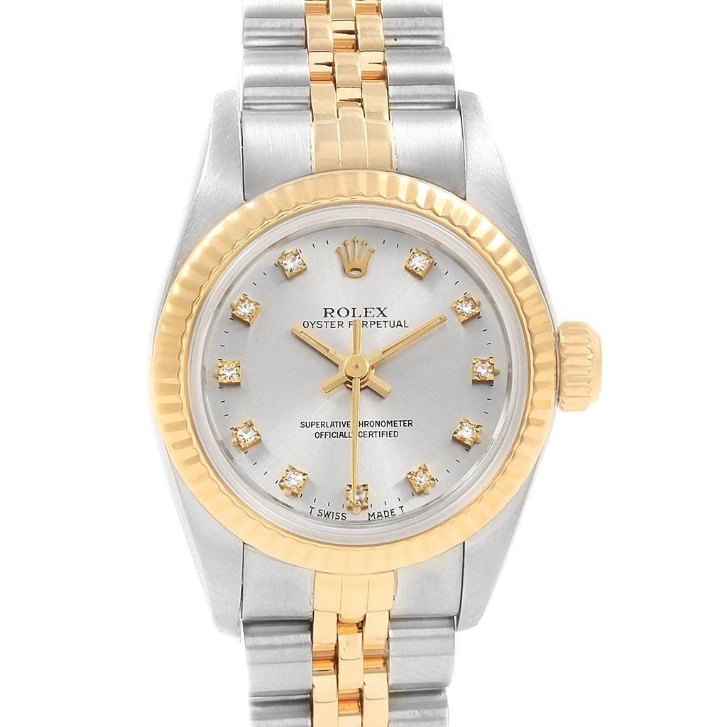 The image shows a front view of a Rolex Oyster Perpetual 67193 Women
s Steel and Gold (two tone) Silver Dial 67193 Women
s Steel and Gold (two tone) Silver Dial watch, highlighting its dial, bezel, crown, and bracelet.