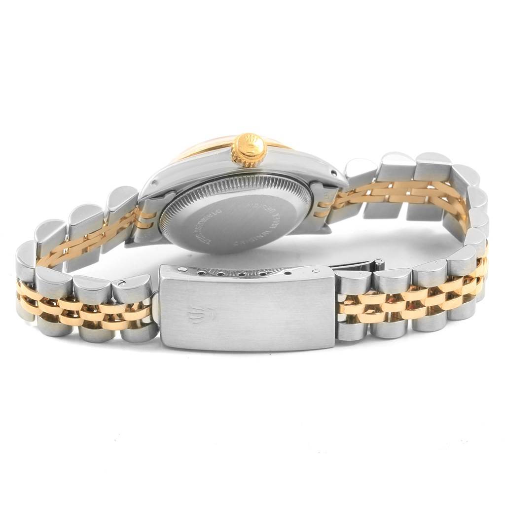 The image shows a Rolex Oyster Perpetual 67193 Women's Steel and Gold (two tone) Champagne Dial 67193 Women's Steel and Gold (two tone) Champagne Dial watch from the backside, highlighting the case back and two-tone bracelet.