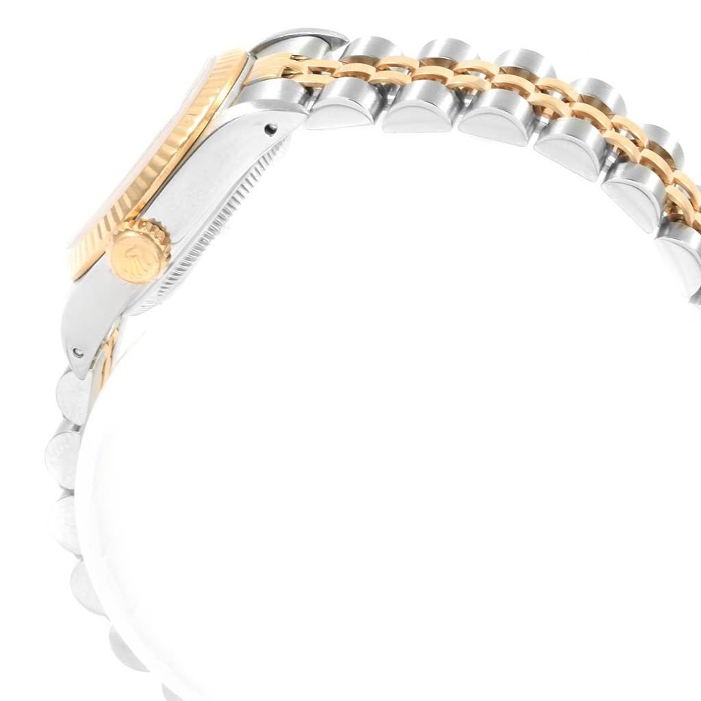 The image shows a side view of a Rolex Oyster Perpetual 67193 Women's Steel and Gold (two tone) Champagne Dial 67193 Women's Steel and Gold (two tone) Champagne Dial watch, highlighting the crown, bezel, and part of the bracelet.