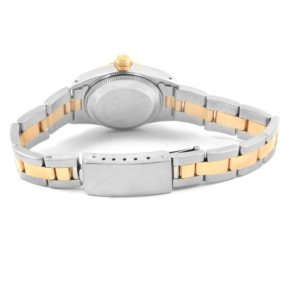 The image shows the back of a Rolex Oyster Perpetual 67193 Women's Steel and Gold (two tone) White Dial 67193 Women's Steel and Gold (two tone) White Dial watch, highlighting its case back and two-tone metal bracelet.