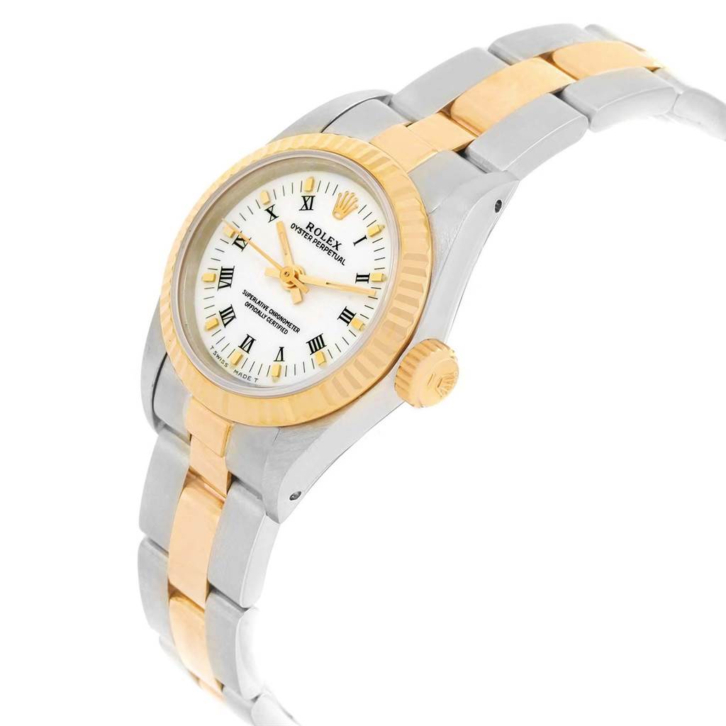 The Rolex Oyster Perpetual 67193 Women's Steel and Gold (two tone) White Dial 67193 Women's Steel and Gold (two tone) White Dial watch is shown at a side angle, displaying its face, bezel, crown, and two-tone band.