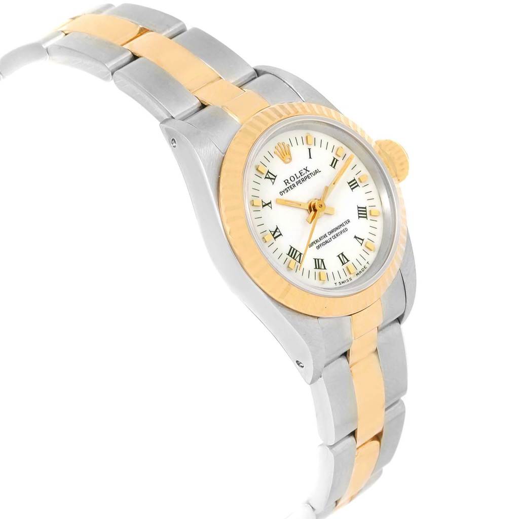 The image shows a side angle of a Rolex Oyster Perpetual 67193 Women's Steel and Gold (two tone) White Dial 67193 Women's Steel and Gold (two tone) White Dial watch featuring its face, bezel, and two-tone bracelet.