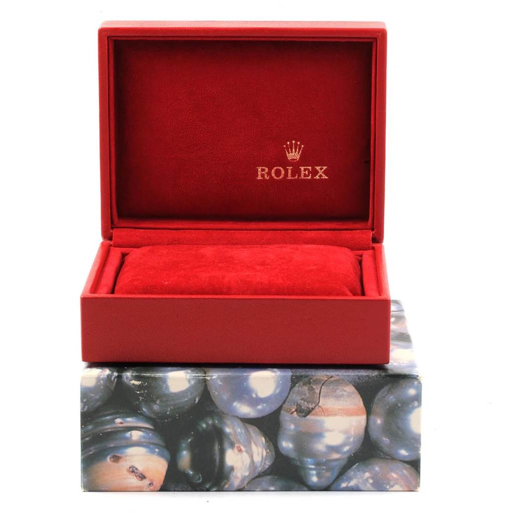 The image shows an open red box for a Rolex Oyster Perpetual 67193 Women's Steel and Gold (two tone) White Dial 67193 Women's Steel and Gold (two tone) White Dial, displaying the brand logo inside the lid.