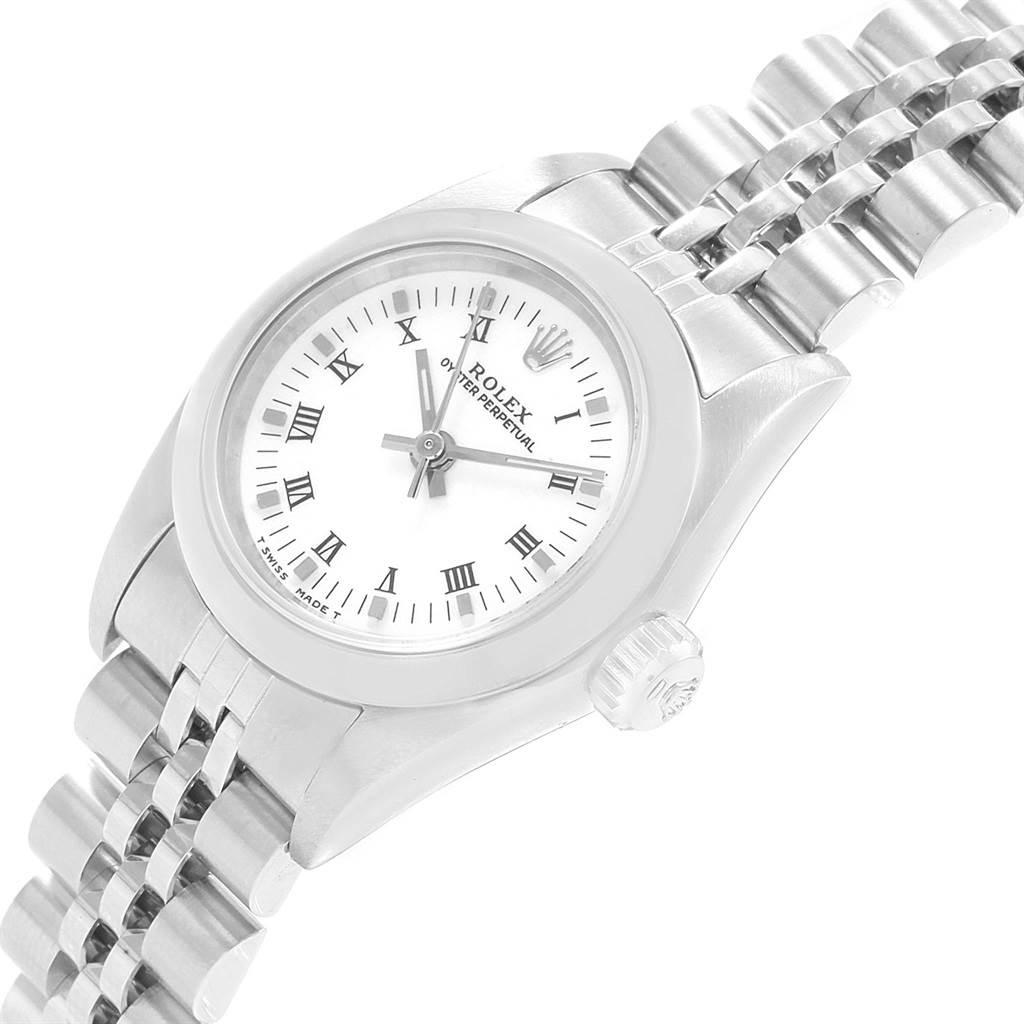 The Rolex Oyster Perpetual 67180 Women's Stainless Steel White Dial 67180 Women's Stainless Steel White Dial watch is shown at a slight angle, displaying its face, bezel, crown, and metal bracelet.