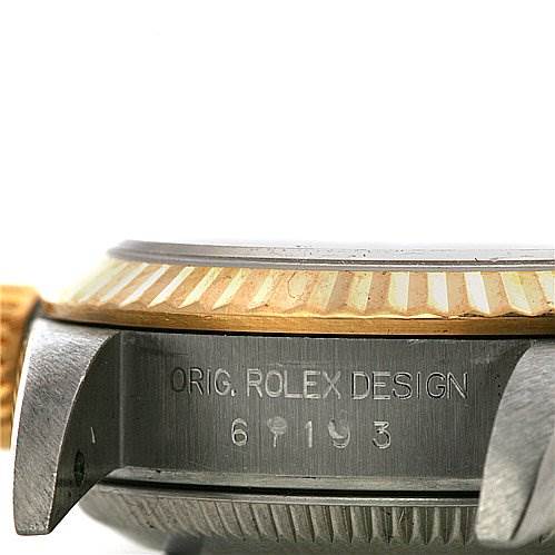 The image shows a close-up side view of the case and bezel of a Rolex Oyster Perpetual 67193 Women's Yellow Gold White Dial 67193 Women's Yellow Gold White Dial watch, highlighting the engravings.