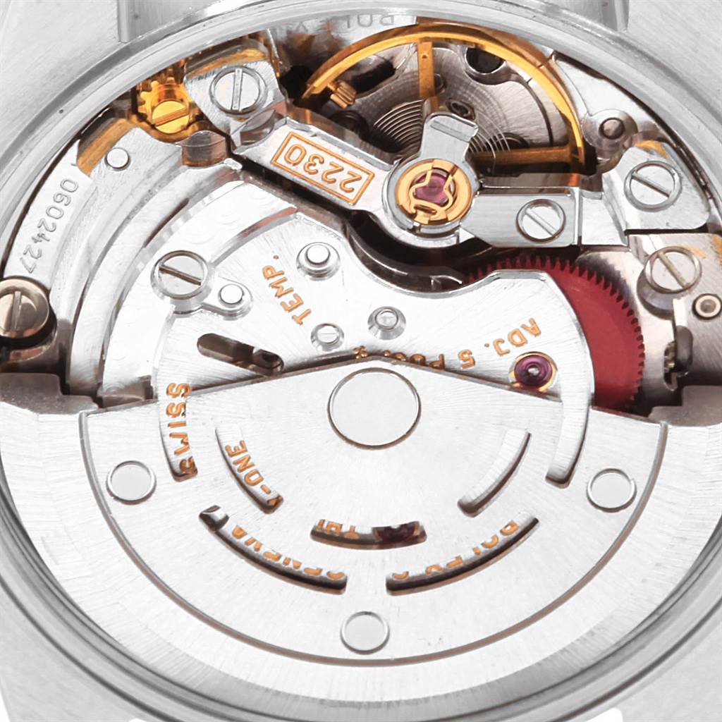 This image shows a close-up view of the movement inside a Rolex Oyster Perpetual 76080 Women's Stainless Steel Black Dial 76080 Women's Stainless Steel Black Dial watch.