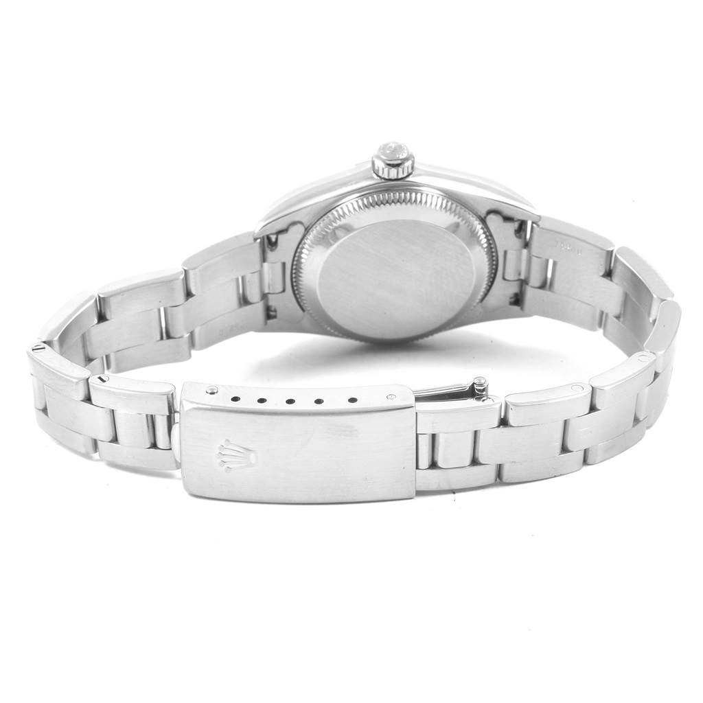 The image shows the back view of a Rolex Oyster Perpetual 76080 Women's Stainless Steel Black Dial 76080 Women's Stainless Steel Black Dial watch, highlighting the case back and bracelet clasp.