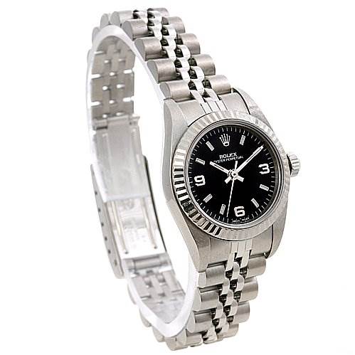 The image shows a Rolex Oyster Perpetual 76094 Women's Stainless Steel Black Dial 76094 Women's Stainless Steel Black Dial watch at an oblique angle, highlighting the black dial, bezel, case, and metal bracelet.