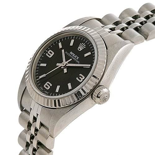 This image shows a side angle of a Rolex Oyster Perpetual 76094 Women's Stainless Steel Black Dial 76094 Women's Stainless Steel Black Dial, highlighting the case, crown, black dial, bezel, and bracelet.