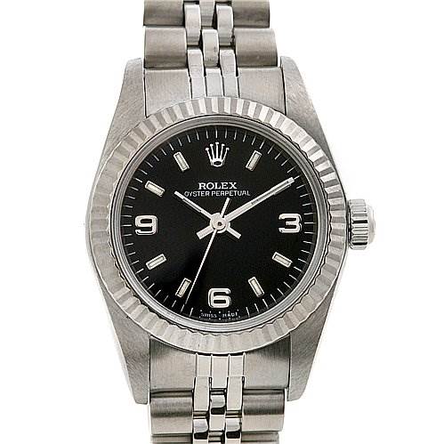 The Rolex Oyster Perpetual 76094 Women's Stainless Steel Black Dial 76094 Women's Stainless Steel Black Dial watch is shown from a front angle, displaying its dial, hands, hour markers, bezel, and bracelet.