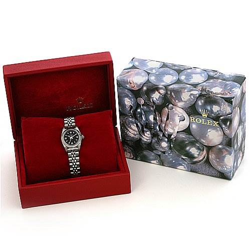 The image shows a Rolex Oyster Perpetual 76094 Women's Stainless Steel Black Dial 76094 Women's Stainless Steel Black Dial watch placed inside a red box alongside its decorative outer packaging.
