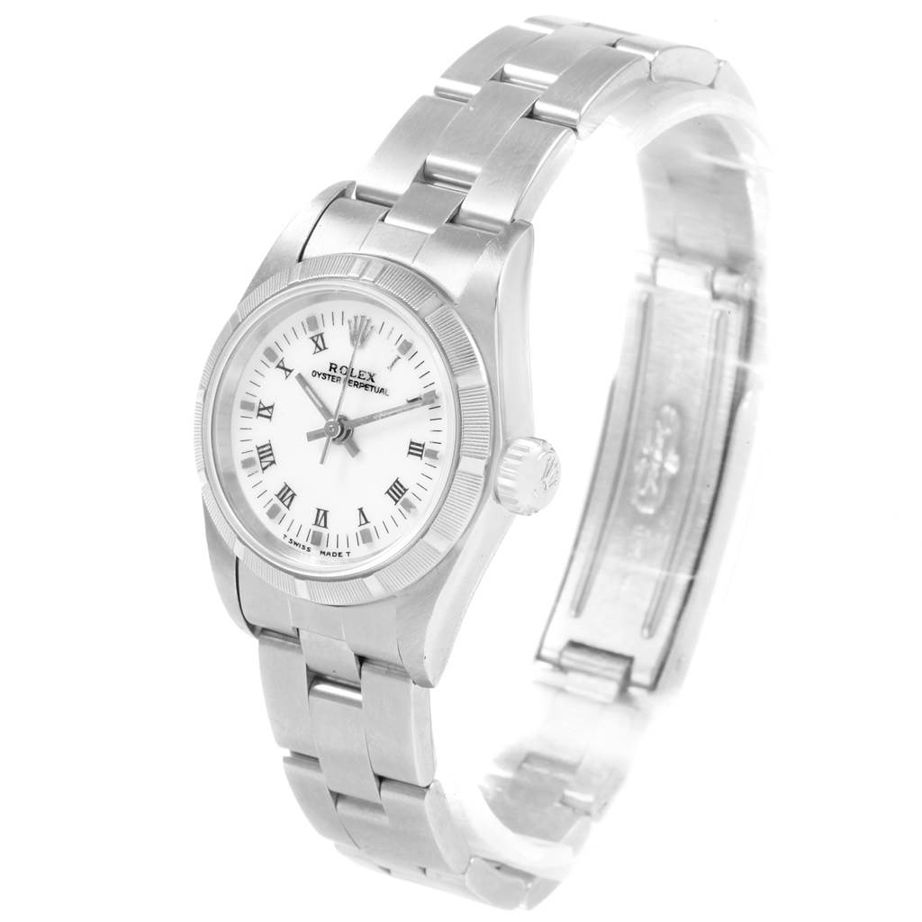 The Rolex Oyster Perpetual 67230 Women's Stainless Steel White Dial 67230 Women's Stainless Steel White Dial watch is shown at a slight angle, displaying the face, bracelet, and clasp.