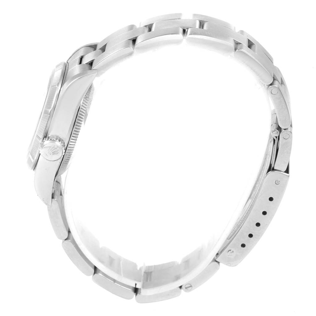 This image shows a side view of the Rolex Oyster Perpetual 67230 Women's Stainless Steel White Dial 67230 Women's Stainless Steel White Dial watch, highlighting the bracelet and clasp.