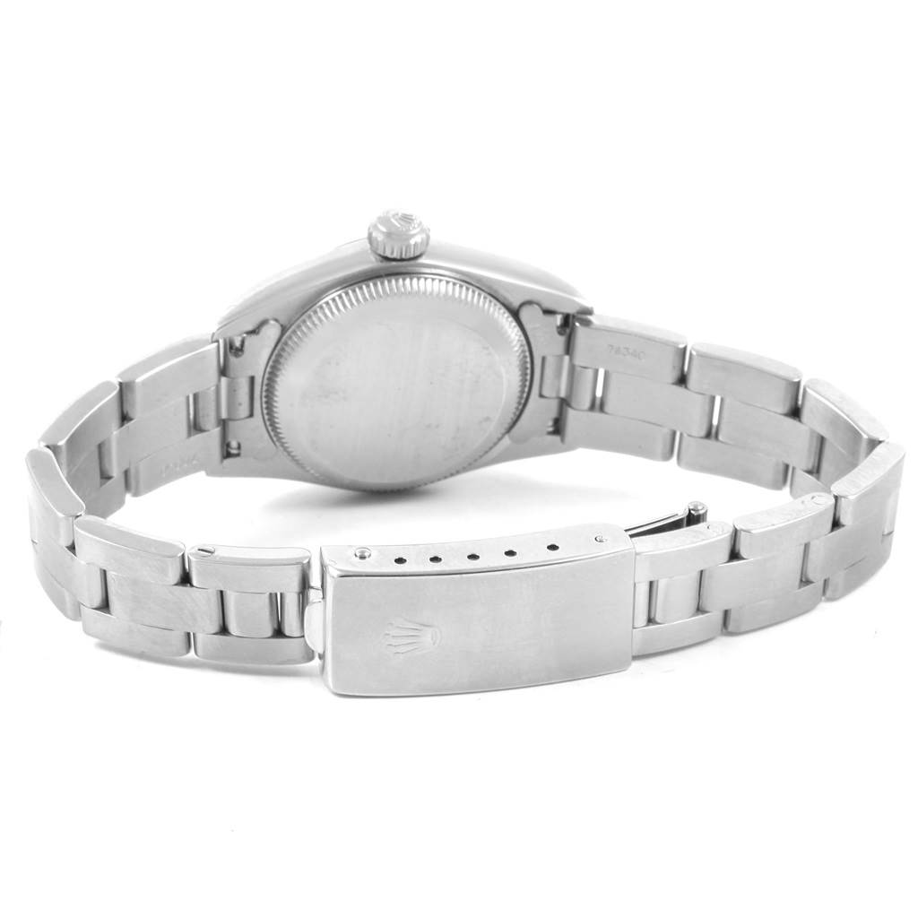 This image shows the backside and bracelet clasp of a Rolex Oyster Perpetual 67230 Women's Stainless Steel White Dial 67230 Women's Stainless Steel White Dial watch.