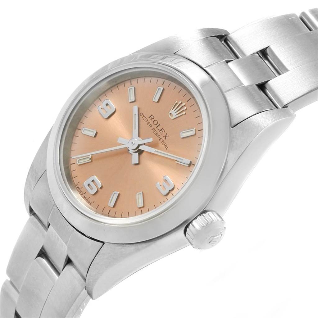 The Rolex Oyster Perpetual 76080 Women
s Stainless Steel Pink Dial 76080 Women
s Stainless Steel Pink Dial watch is shown at a slight angle, displaying its dial, case, bezel, crown, and bracelet.
