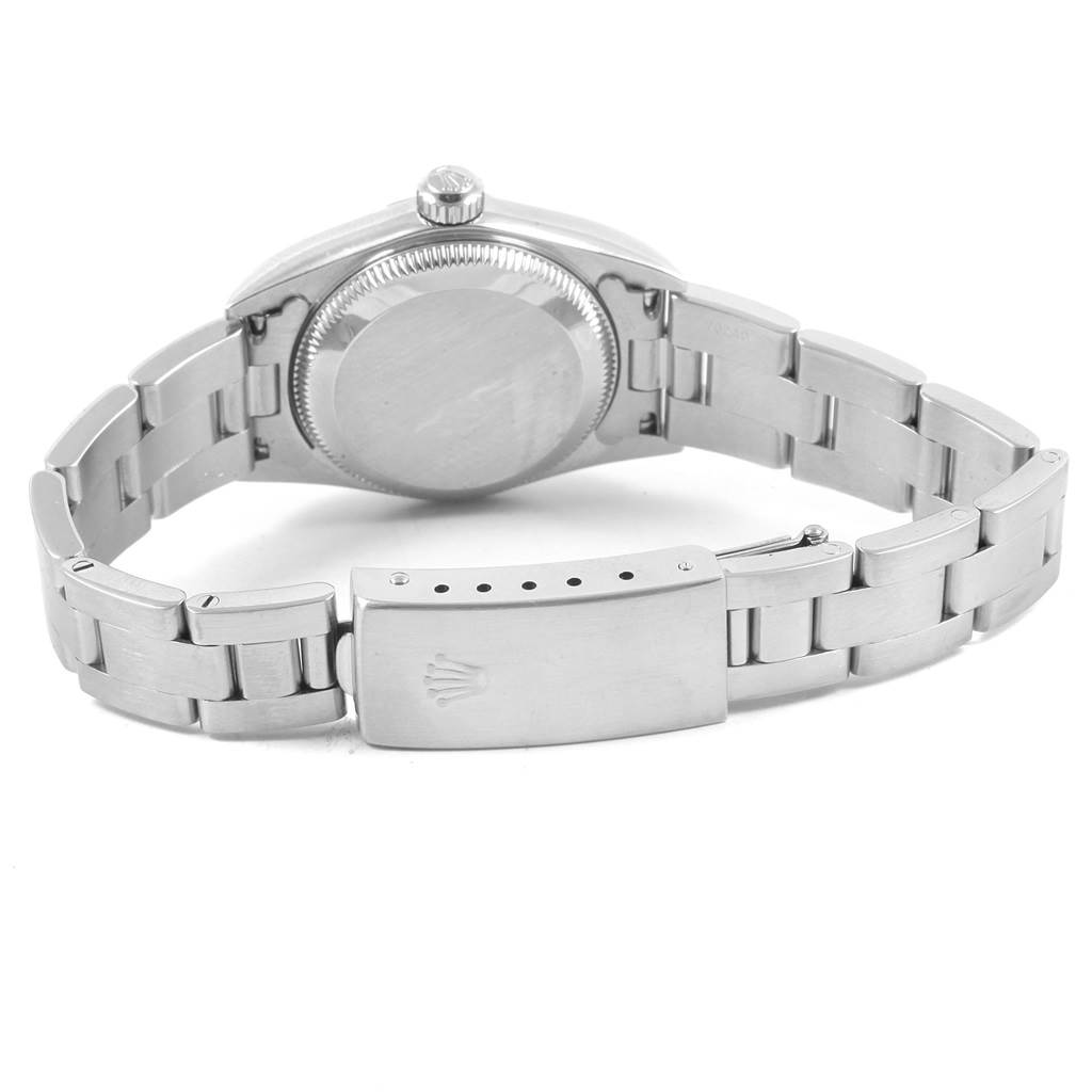 This image shows the back and clasp of a Rolex Oyster Perpetual 76080 Women
s Stainless Steel Pink Dial 76080 Women
s Stainless Steel Pink Dial watch, highlighting its stainless steel bracelet and case.