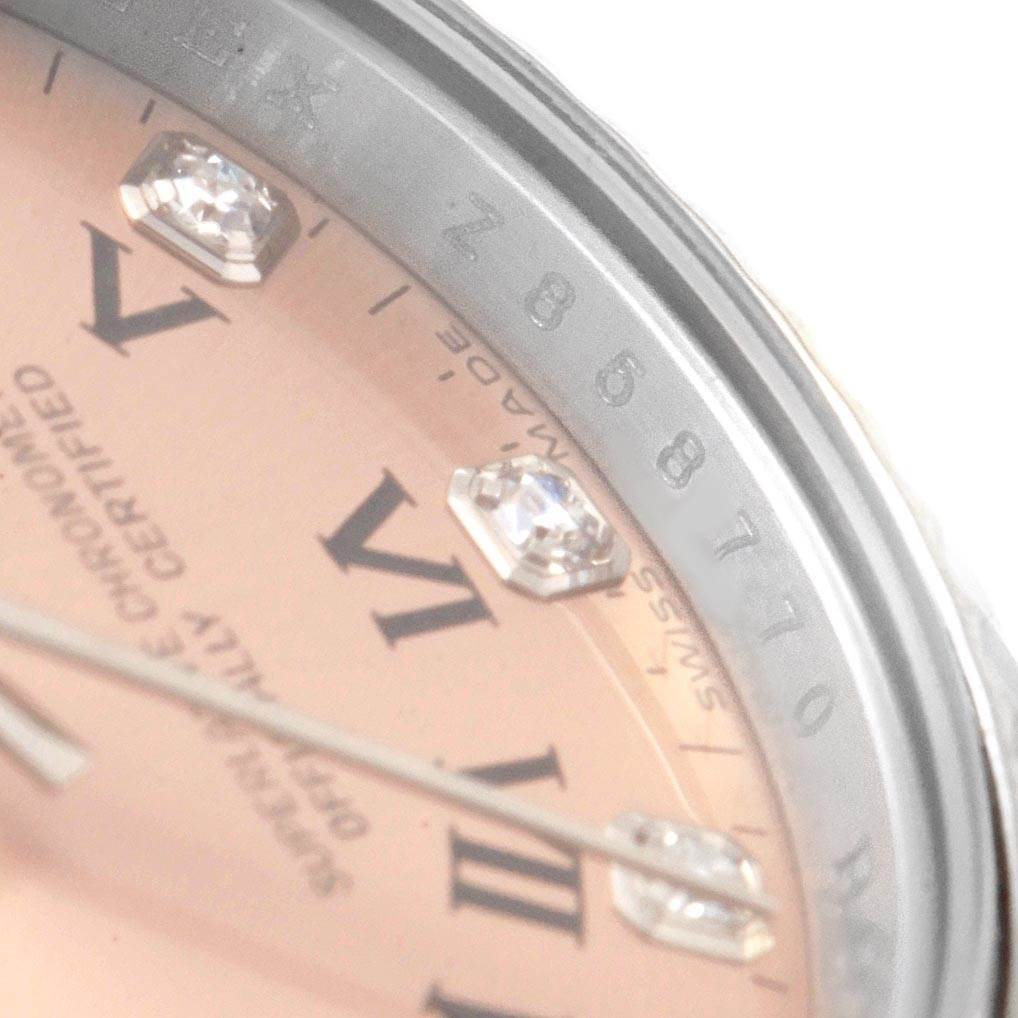 The image shows a close-up of the dial and bezel of a Rolex Oyster Perpetual 176234 Women
s Stainless Steel Pink Dial 176234 Women
s Stainless Steel Pink Dial watch, highlighting the numerals and gemstones.