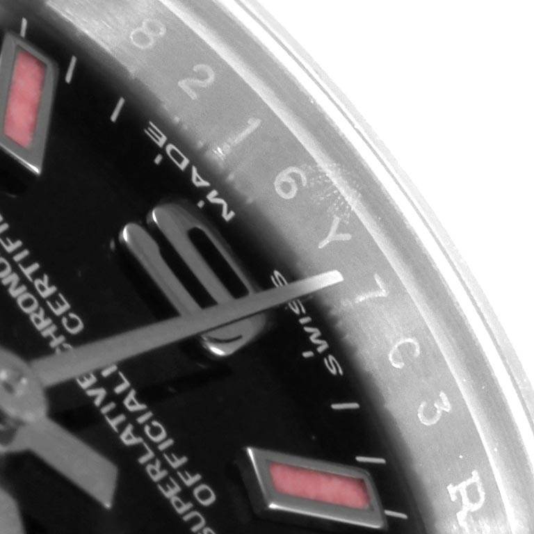 The image shows a close-up of the dial and bezel of a Rolex Oyster Perpetual 176200 Women's Stainless Steel Black Dial 176200 Women's Stainless Steel Black Dial watch, focusing on the hour markers and part of the hands.