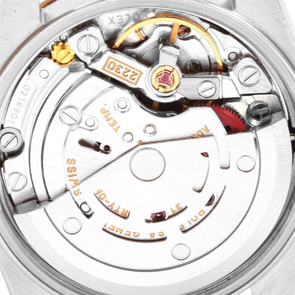 The image shows the internal movement mechanism of a Rolex Oyster Perpetual 76193 Women
s Steel and Gold (two tone) Grey Dial 76193 Women
s Steel and Gold (two tone) Grey Dial watch from a close-up, rear angle.