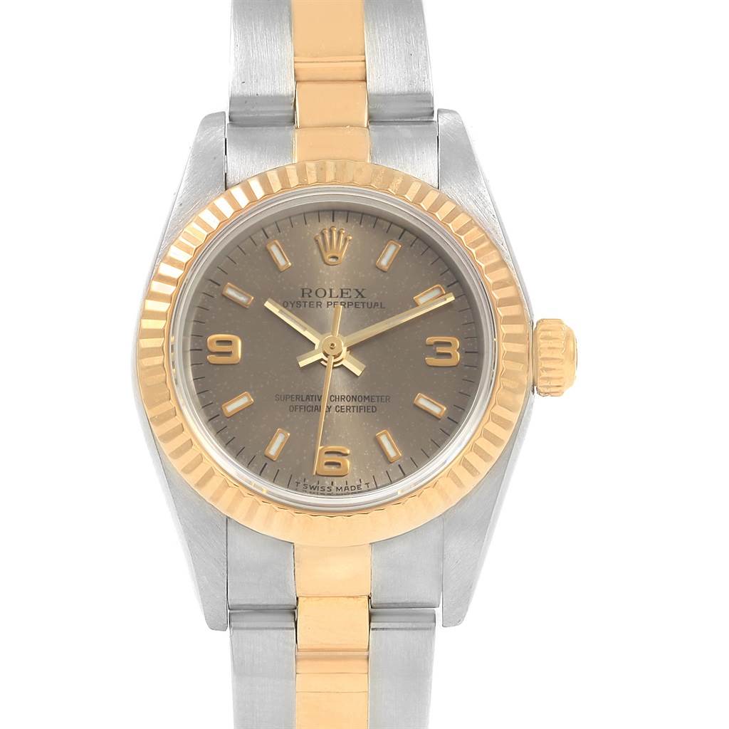 The Rolex Oyster Perpetual 76193 Women
s Steel and Gold (two tone) Grey Dial 76193 Women
s Steel and Gold (two tone) Grey Dial watch is shown from a top-down angle, displaying the face, case, bezel, and part of the bracelet.
