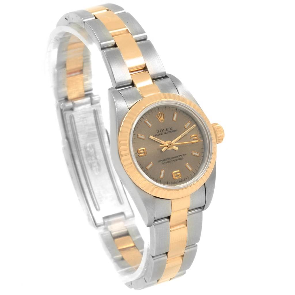 The image shows a side-angle view of an Oyster Perpetual Rolex watch, highlighting its face and bracelet.