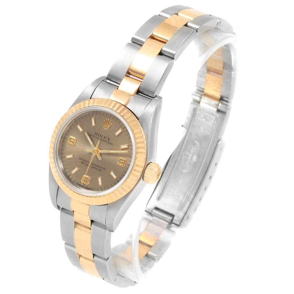 This image shows a Rolex Oyster Perpetual 76193 Women
s Steel and Gold (two tone) Grey Dial 76193 Women
s Steel and Gold (two tone) Grey Dial watch at an angle displaying the face, bezel, crown, and two-tone bracelet.