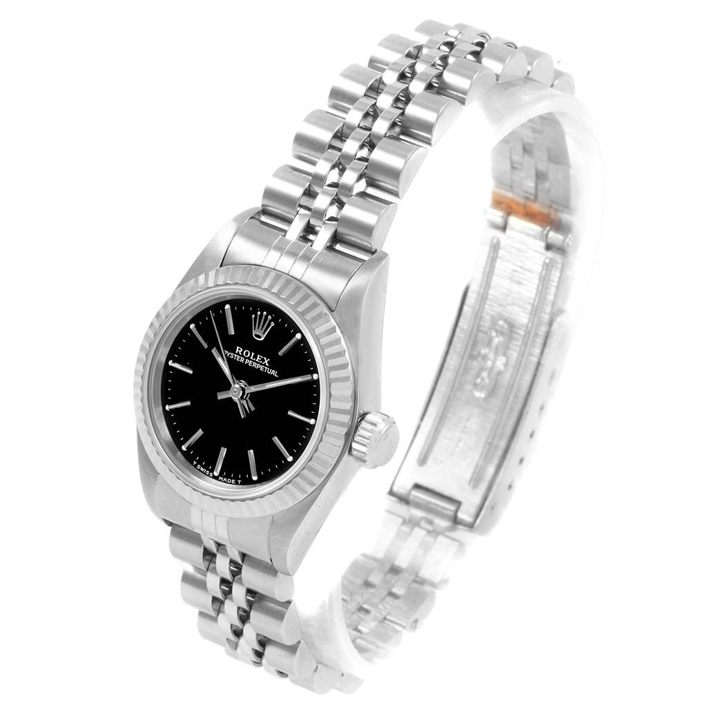 The image shows a Rolex Oyster Perpetual 67194 Women
s Stainless Steel Black Dial 67194 Women
s Stainless Steel Black Dial watch from an angled side view, highlighting the dial, bezel, and bracelet.