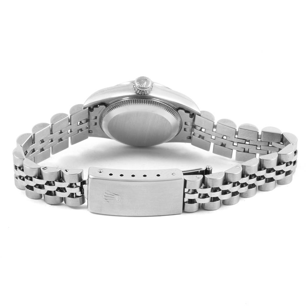 This image shows the backside of a Rolex Oyster Perpetual 67194 Women
s Stainless Steel Black Dial 67194 Women
s Stainless Steel Black Dial watch, including the case back and the open bracelet with the clasp.