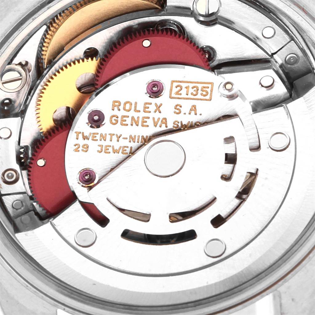Close-up view of the movement mechanism in a Rolex Oyster Perpetual 67194 Women
s Stainless Steel Black Dial 67194 Women
s Stainless Steel Black Dial, showcasing gears and the rotor.