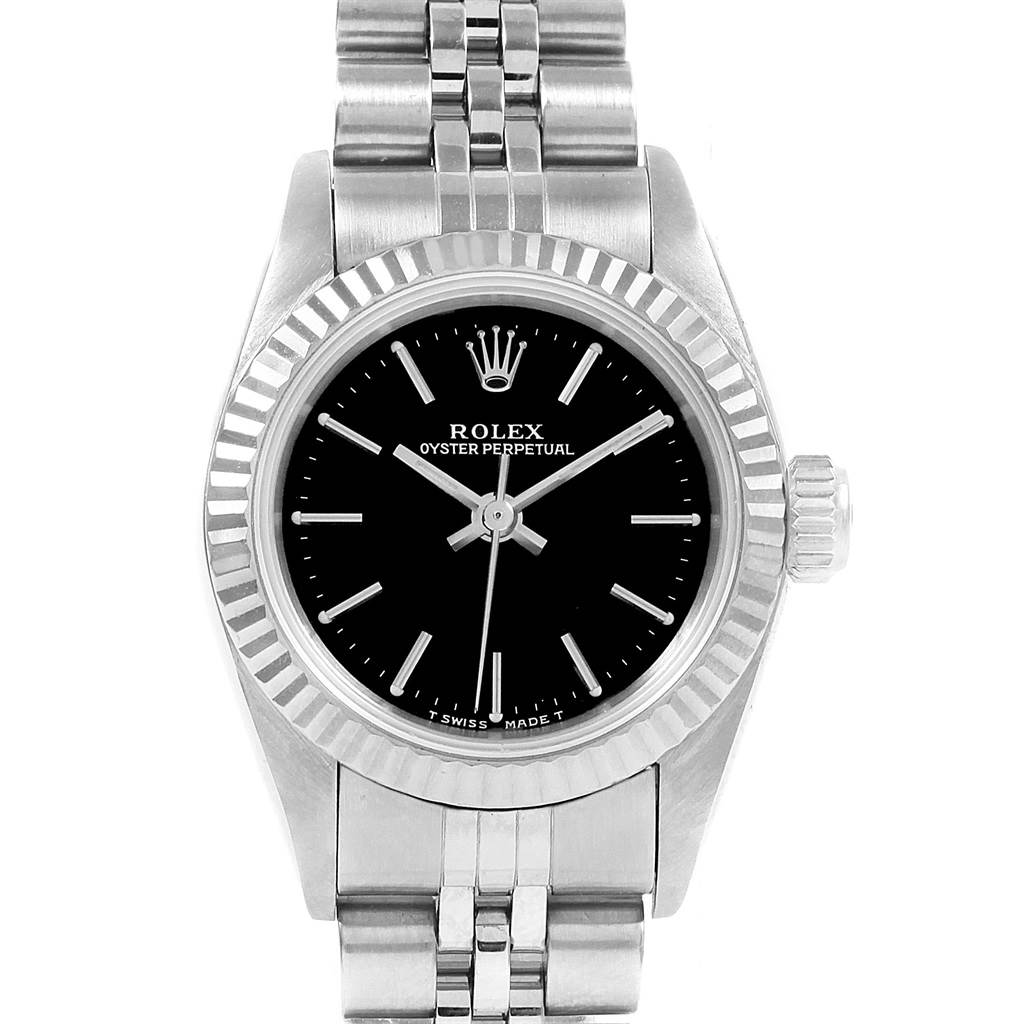 This Oyster Perpetual Rolex watch is shown from a front angle, highlighting the black dial, bezel, and bracelet.